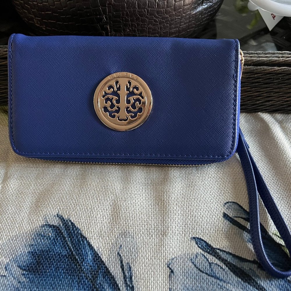Blue designer clutch wallet with strap handle